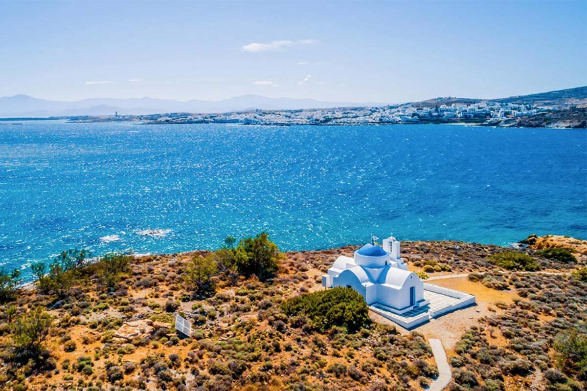 Analipsi islet and Agia Kali church in Naoussa Bay, Paros